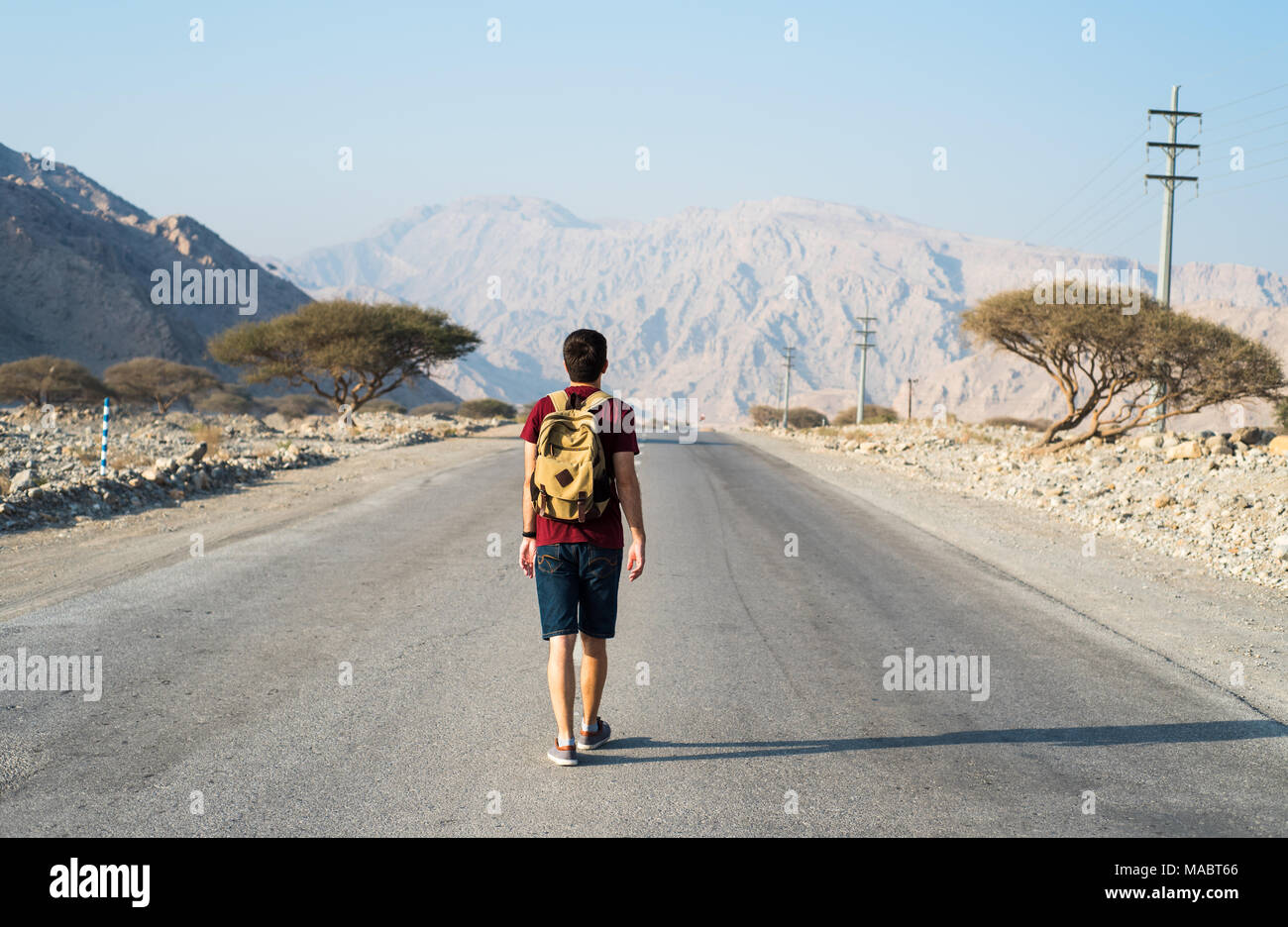 Man walking empty road hi-res stock photography and images - Alamy