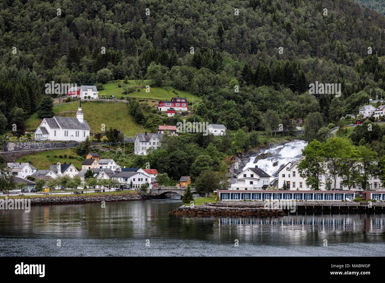 Hellesyltfossen, a beautiful waterfall that divides the village of Hellesylt (Norway) into two parts. Stock Photo