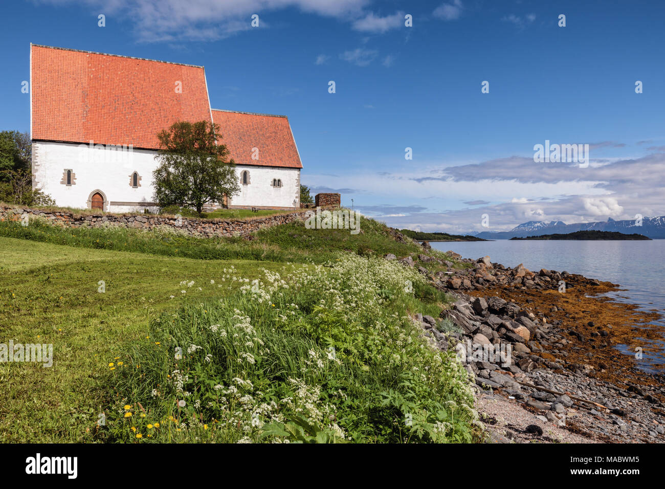 Trondenes Church in Harstad is the northernmost medieval stone church of Norway and the world's northernmost surviving medieval building. Stock Photo