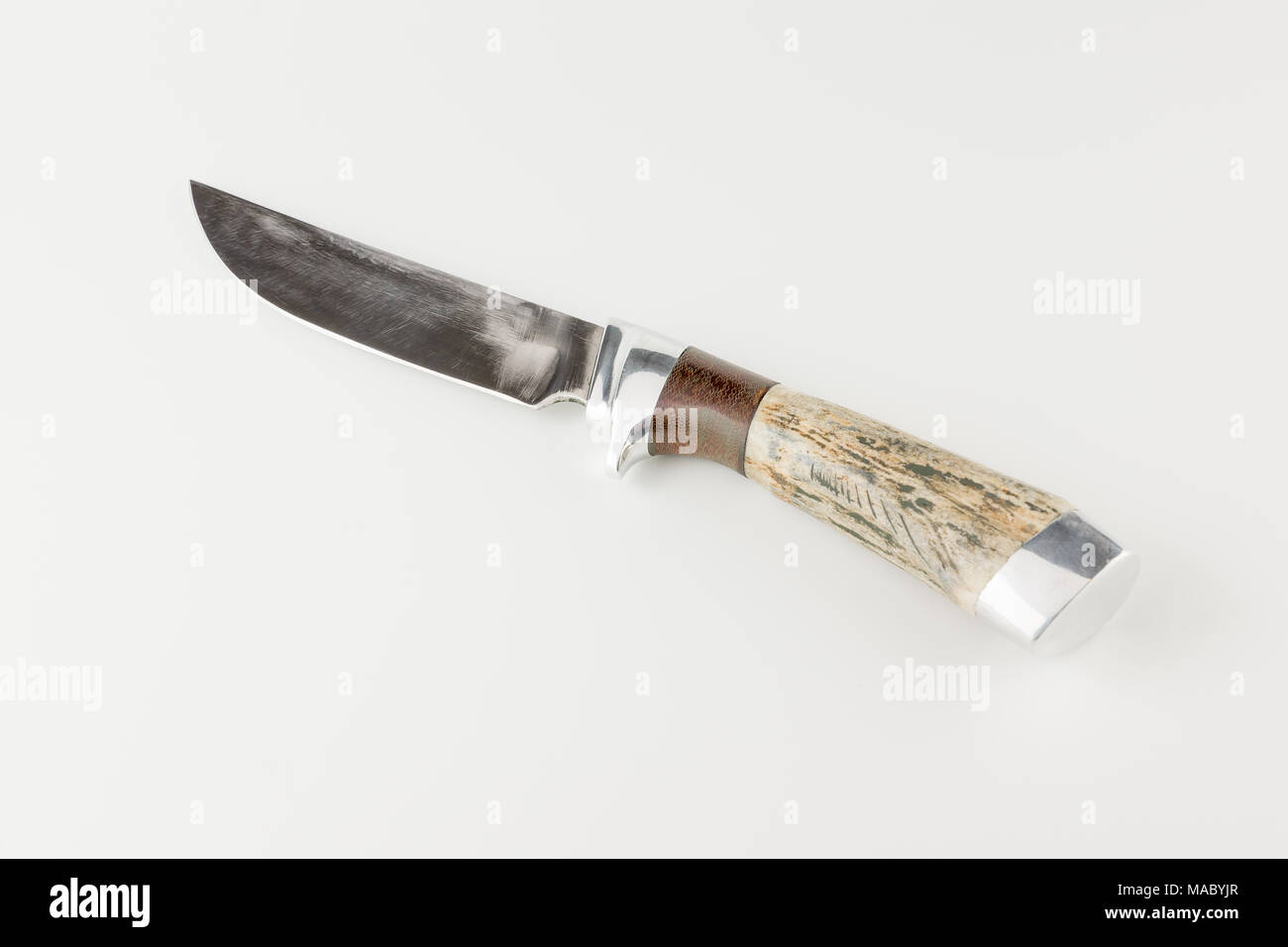 Hunting knife with bone handle isolated on white background Stock Photo
