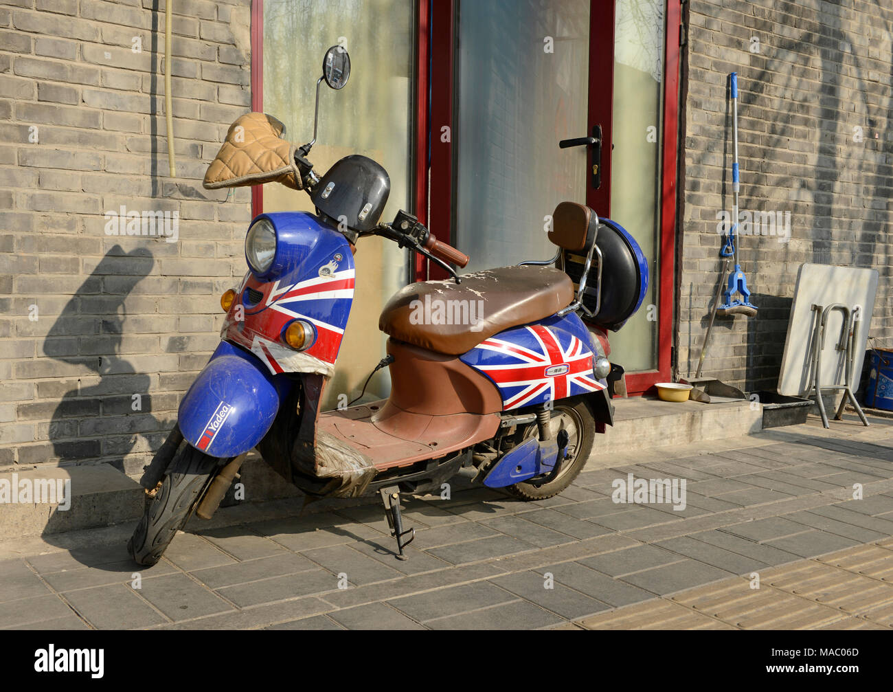 An electric motorscooter painted in the UK's Union Jack flag pattern