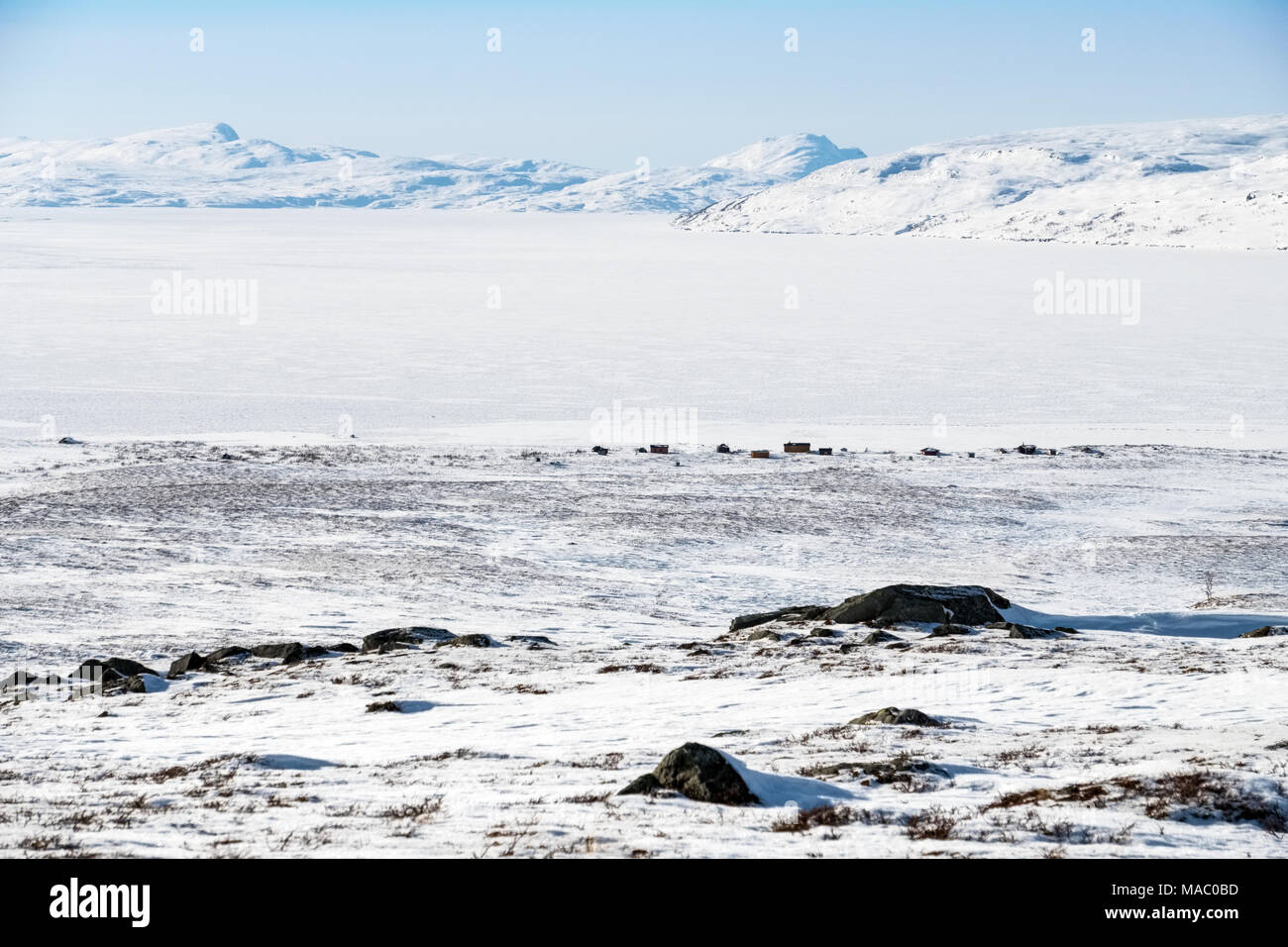 A Sami / Lapland / Lappish village on the edge of a frozen lake in the Padjelanta National Park, Sweden Stock Photo