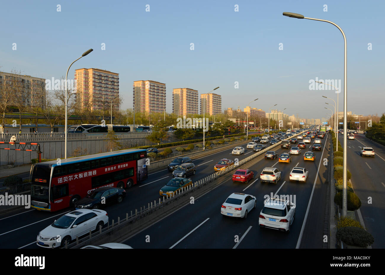 Busy traffic on the Second Ring Road at Andingmen in Beijing late on a Sunday in March 2018 Stock Photo