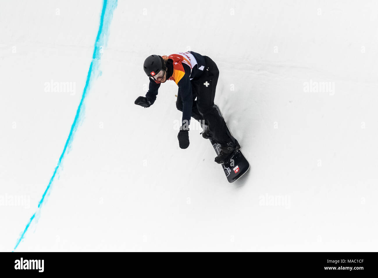 Patrick Burgener (SUI) competing in the Men's Snowboarding Half Pipe