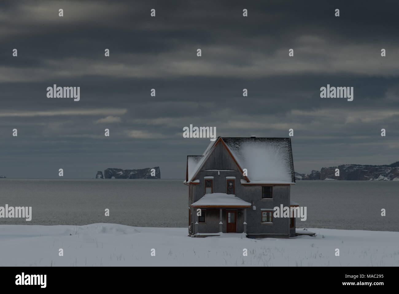 Charming house with Perce Rock, Quebec, Canada in the background Stock