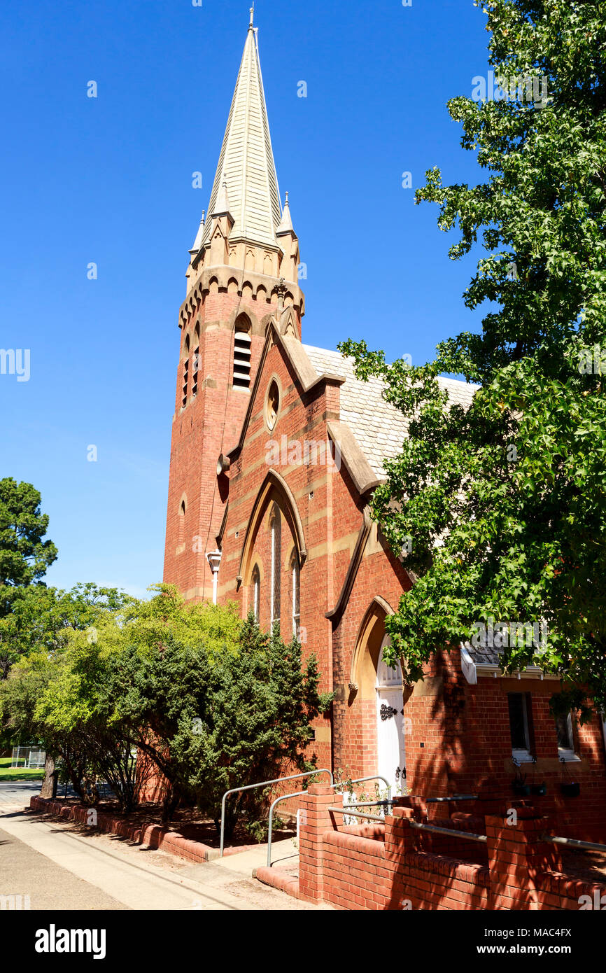 St John Uniting Church opened in 1908 and was built in Federation Gothic style with a cruciform roof plan and bell tower, in Narrandera, New South Wal Stock Photo