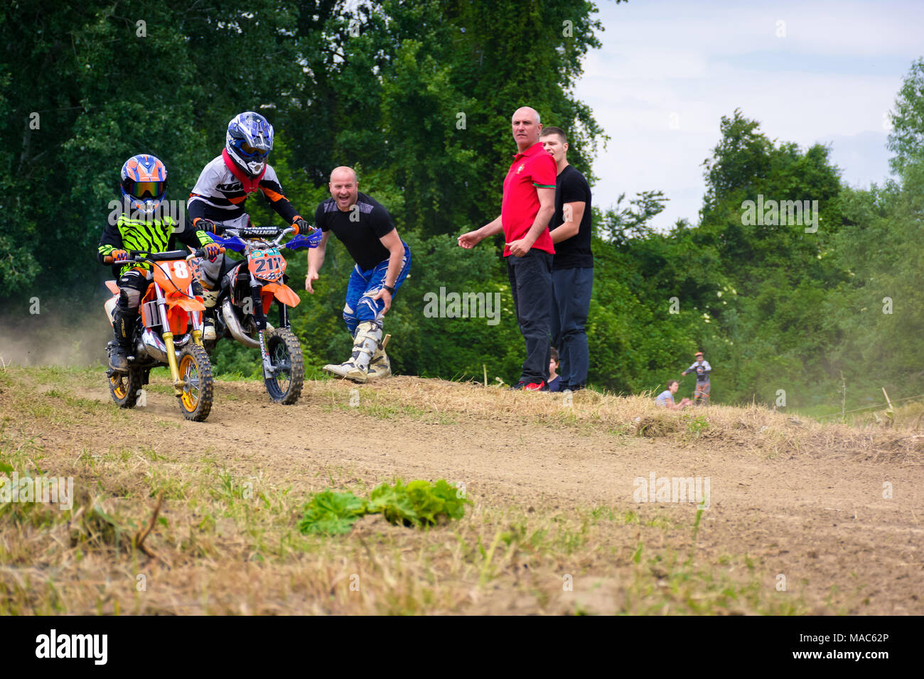 Uzhgorod, Ukraine - May 21, 2017: Extreme enduro MOTO SPORT Junior riders in the action. Parents show their support. TransCarpathian regional Motocros Stock Photo