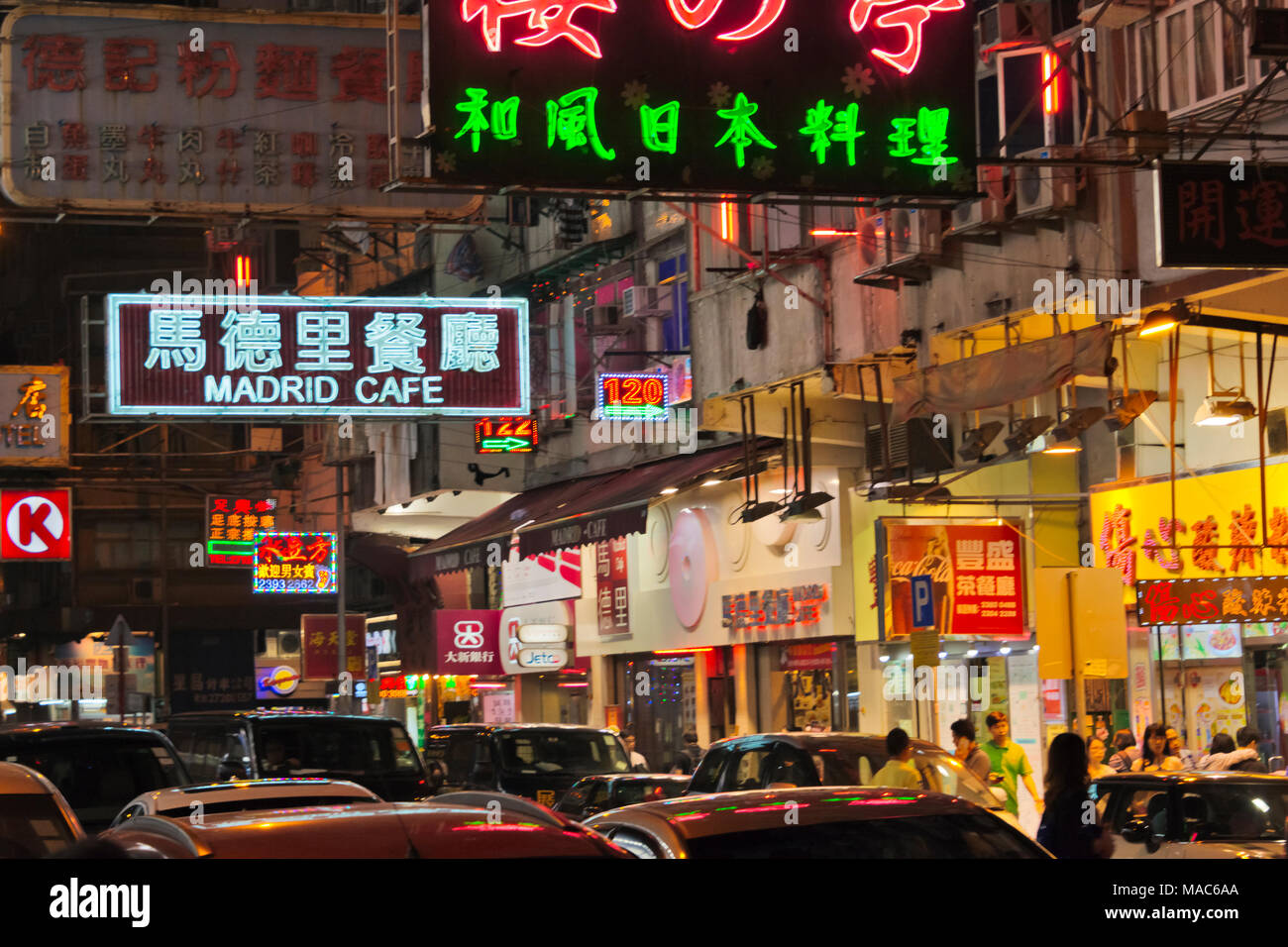 Night view of neon signs of shops, Hong Kong, China Stock Photo