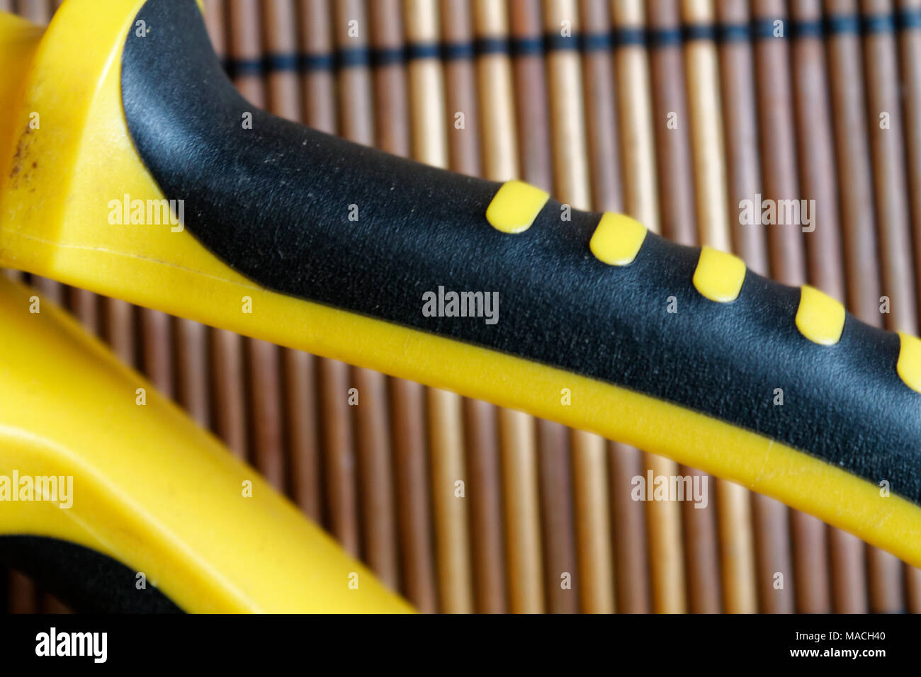 Pliers also known as pointy nose pliers or long nose pliers isolated on wooden background. Stock Photo