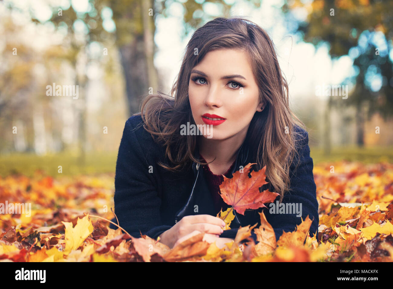 Beautiful woman leaves background hi-res stock photography and images ...