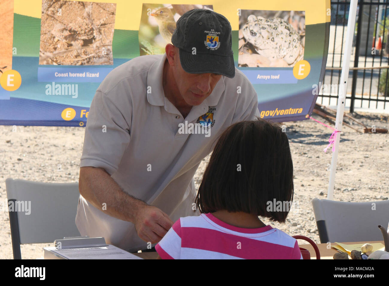 Seed packets fish and wildlife biologist mark ogonowski helps a young