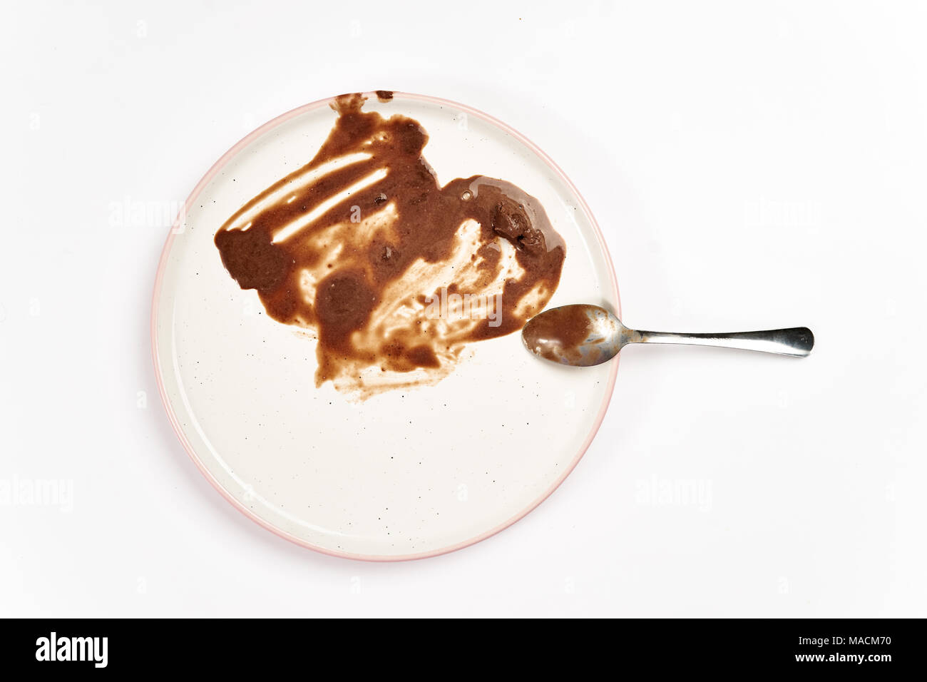 Top view of dirty plate with ice cream stains and fat Stock Photo