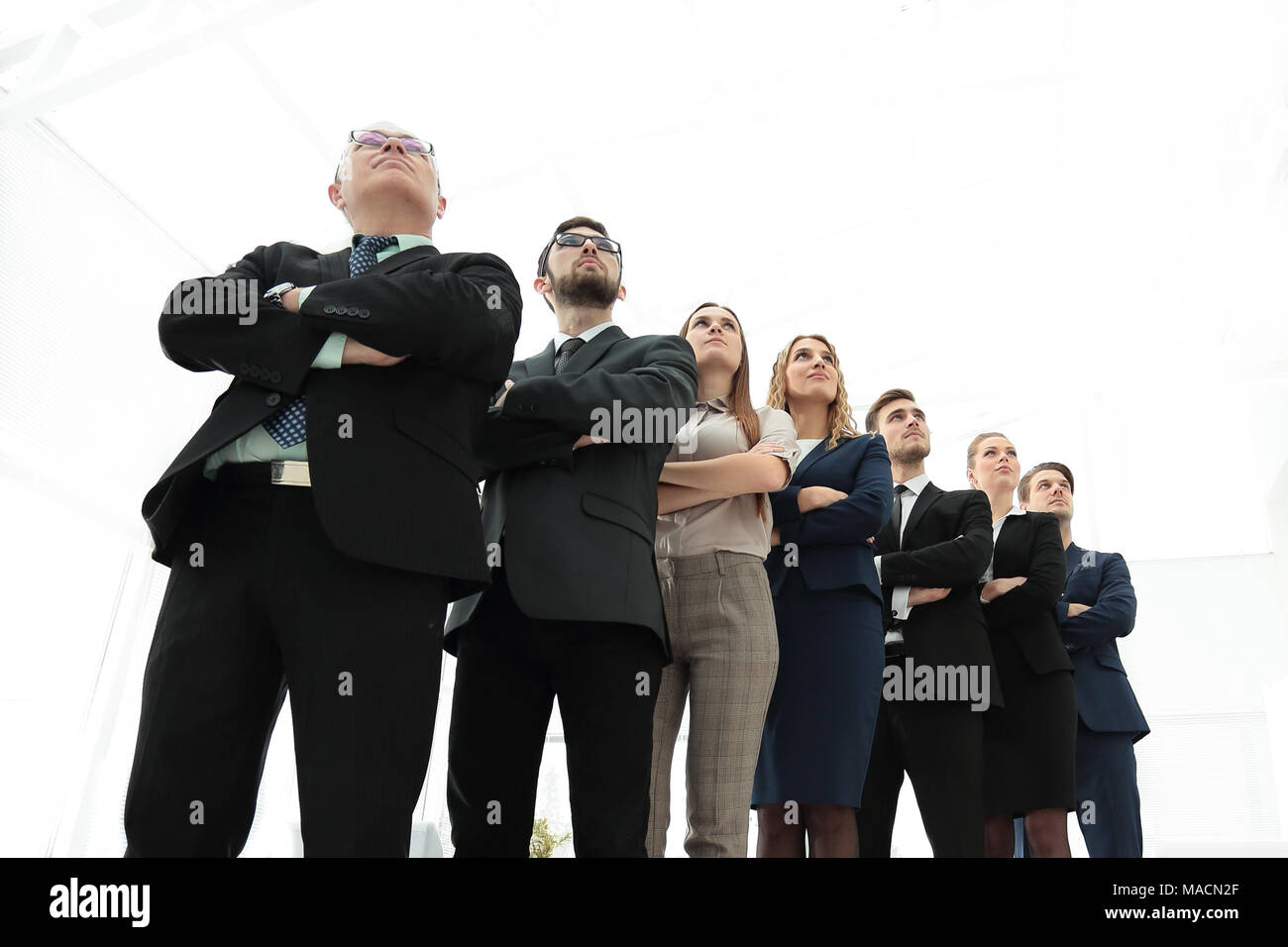 bottom view. successful business team standing together Stock Photo - Alamy