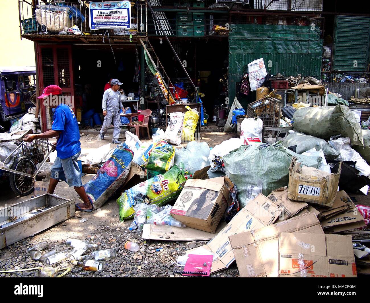 ANTIPOLO CITY, PHILIPPINES MARCH 28, 2018 Workers of a junk shop or