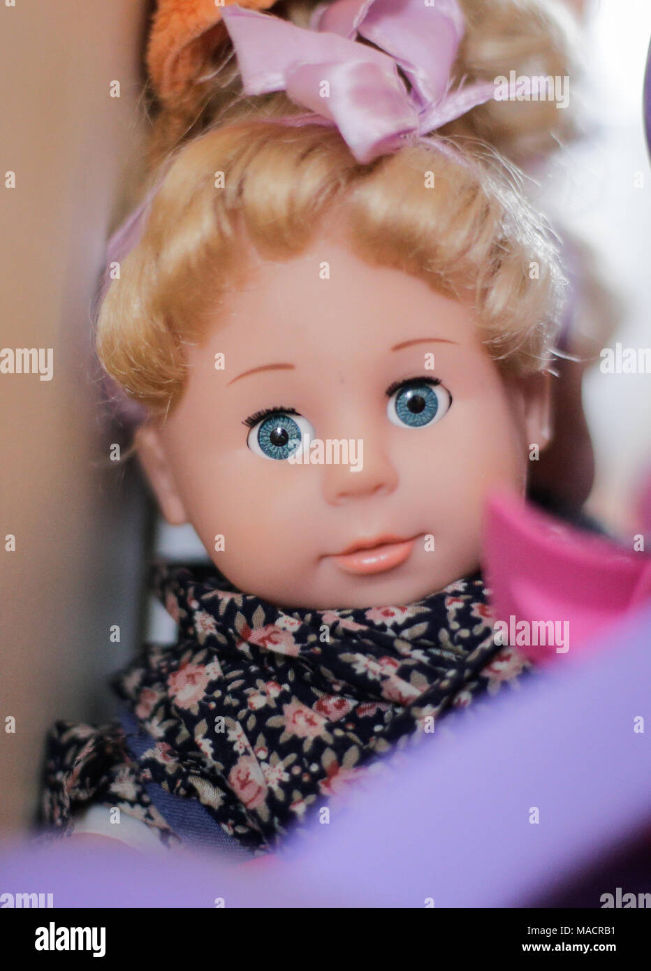 Plastic doll in a child's room Stock Photo Alamy