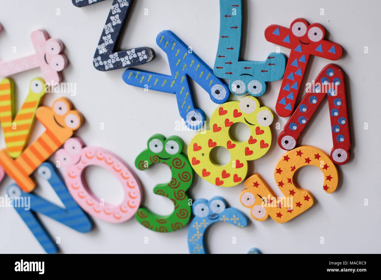 Colourful messed up letters on a refrigerator Stock Photo Alamy