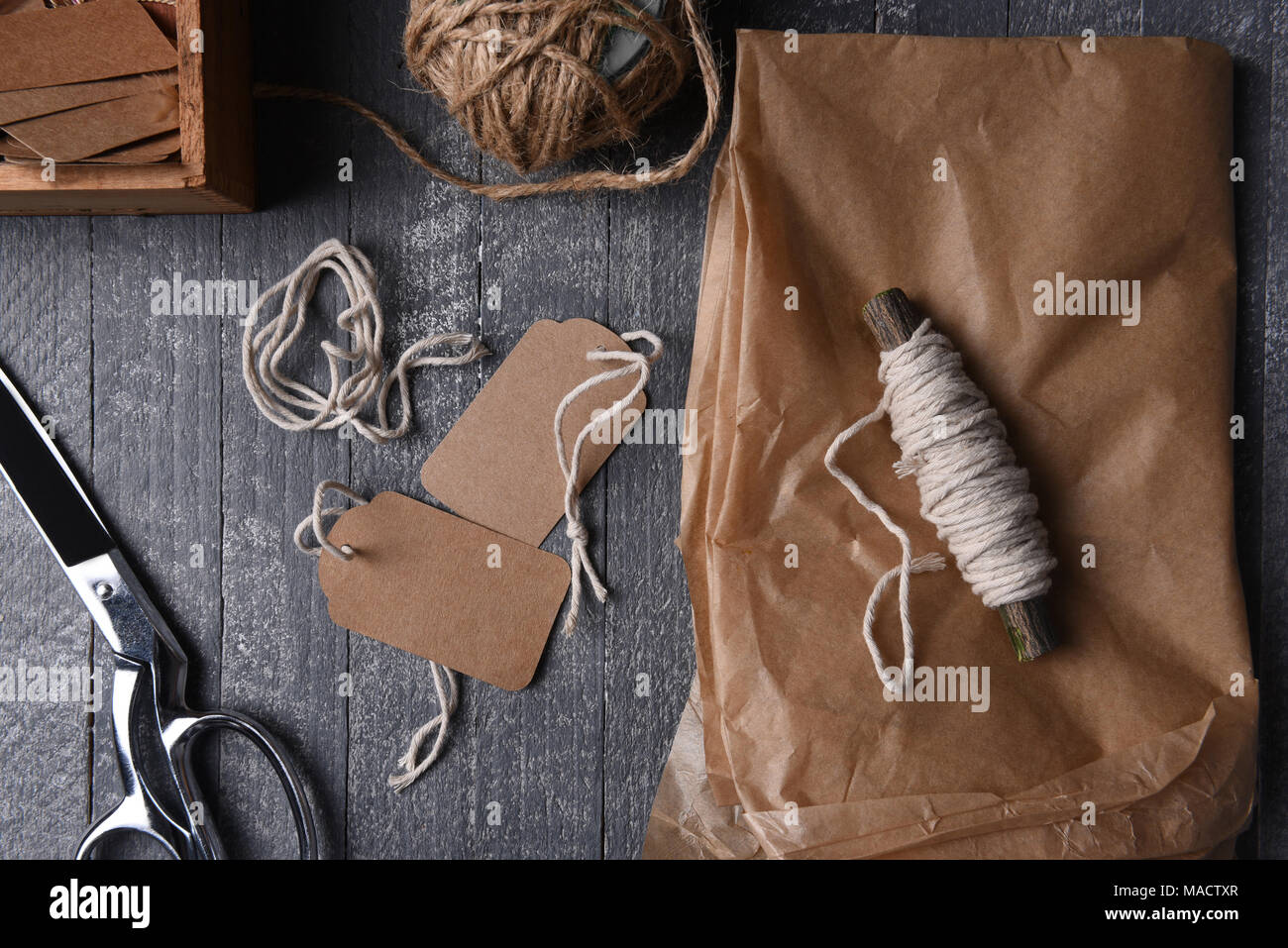 Christmas background with wrapping paper, scissors and Christmas  paraphernalia. Flat lay. Stock Photo by ja-aljona
