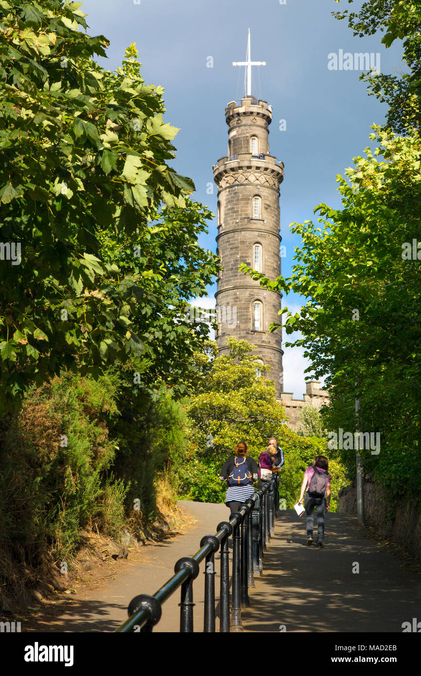 Tourists walk the pathway toward the Admiral Nelson Memorial Tower on Calton Hill, Edinburgh, Lothian, Scotland, UK Stock Photo