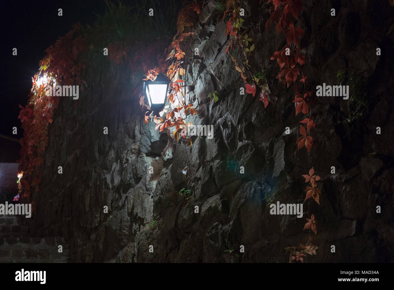 Dark scene with night medieval stairs and street lights in Banska Stiavnica, Slovakia. Stock Photo