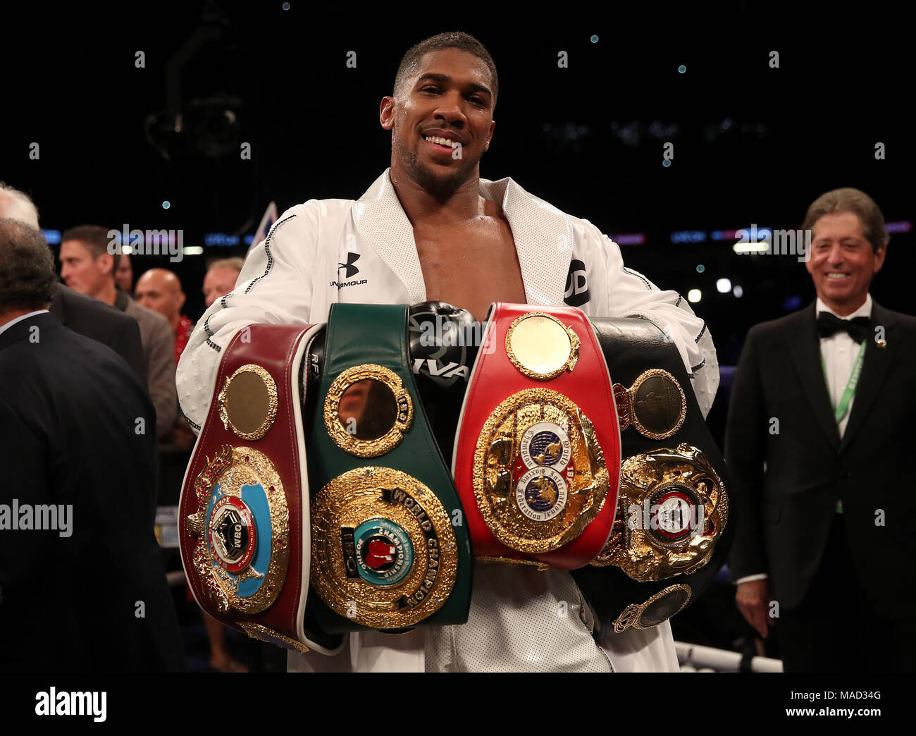 Anthony Joshua celebrates with his belts after victory over Joseph Parker  in their WBA, IBF, WBO and IBO Heavyweight Championship contest at the  Principality Stadium, Cardiff Stock Photo - Alamy