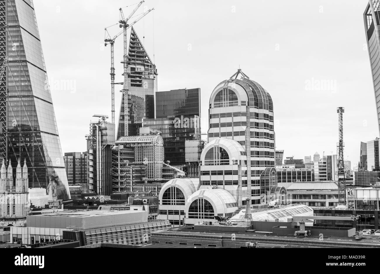 The Scalpel under construction behind the Lloyds Building flanked by the Cheesegrater, Willis Building and 20 Gracechurch Street, City of London, UK Stock Photo