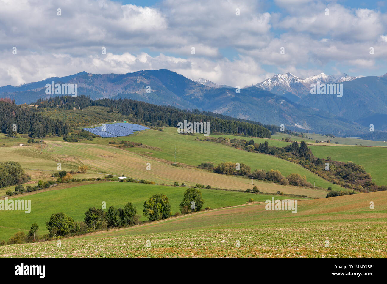 Summer hills landscape with solar panels close to Benusovce village in ...