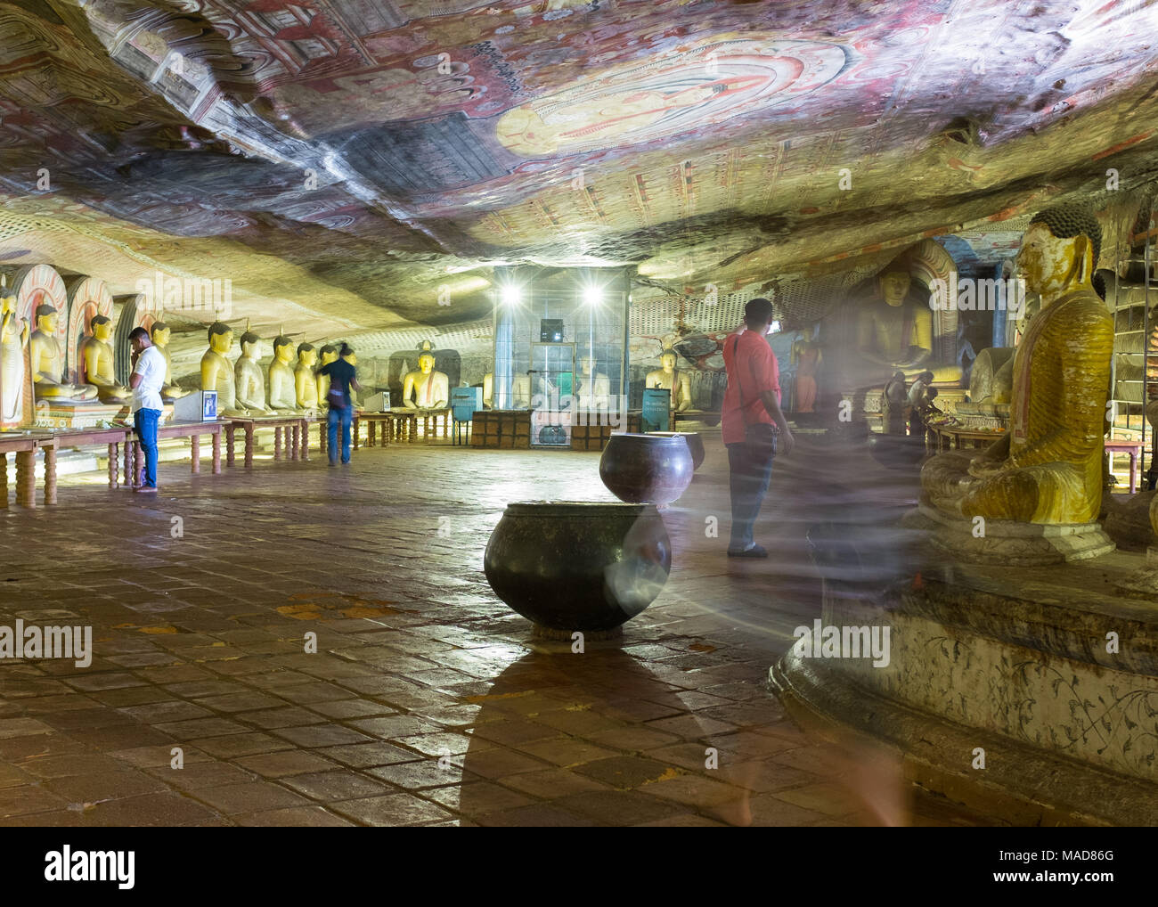 Tourists inside Dambulla Cave Temple, Dambulla, Sri Lanka, Asia. Stock Photo