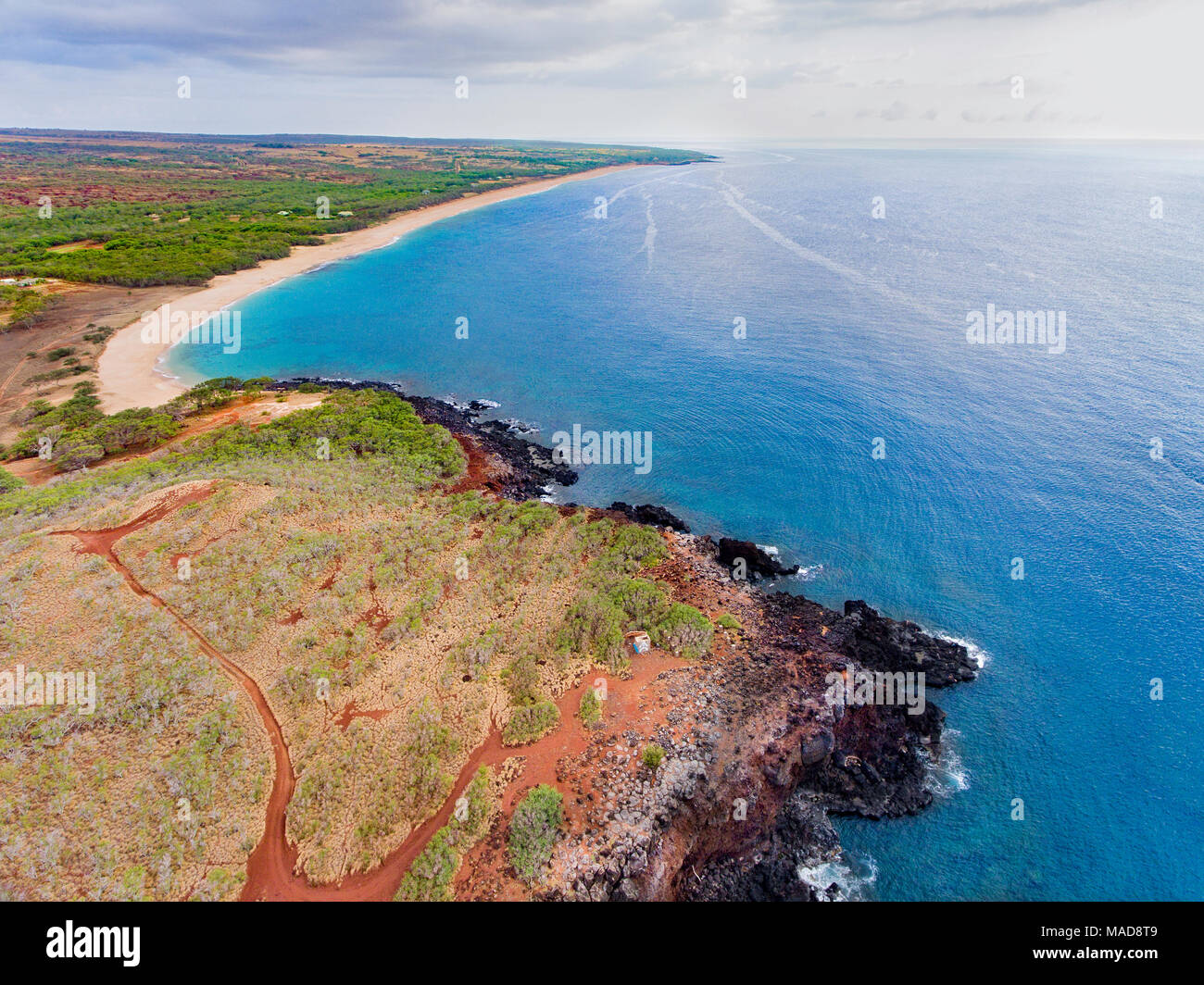 An aerial view of Kaiaka Point and two mile long, three hundred feet wide, Papohaku Beach just beyond on the west shore of Molokai. This is the longes Stock Photo