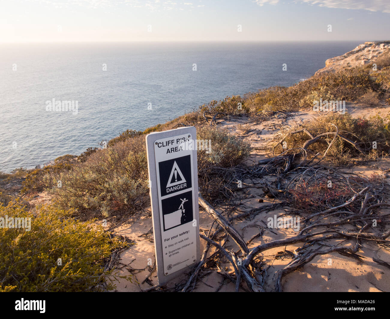 KALBARRI, WESTERN AUSTRALIA - March 4, 2018: Cliff Risk Area danger sign along the ocean cliffs in Kalbarri National Park. Stock Photo