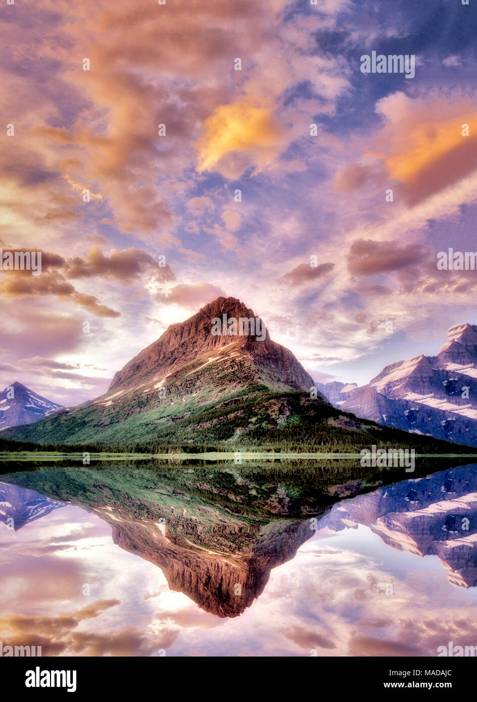 Sunset on Swiftcurrent Lake with Mount Wilbur. Glacier National Park, Montana. Stock Photo