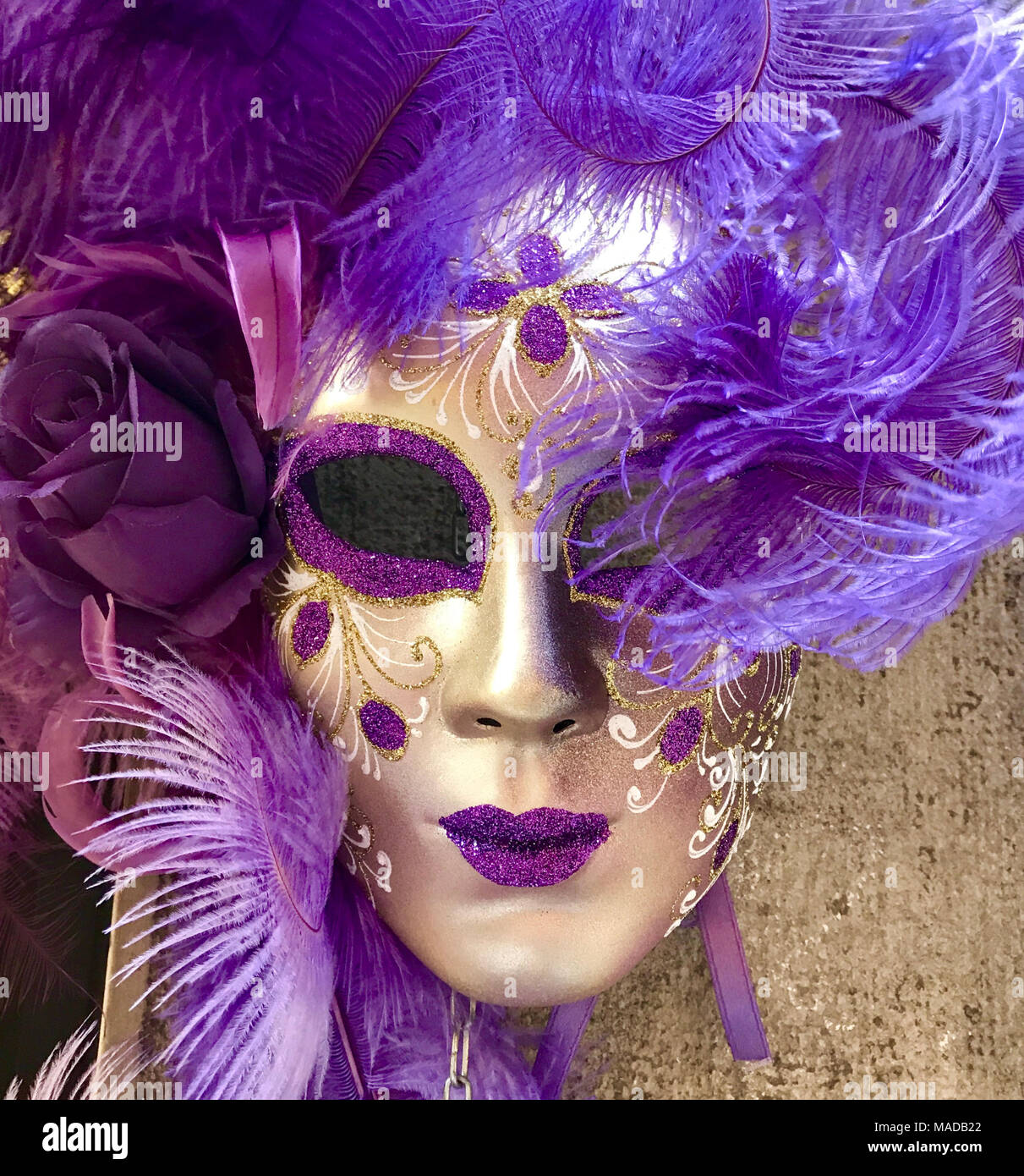 Masquerade Mask in Purple and Gold. Traditional Venetian Costume. Square image. Stock Photo