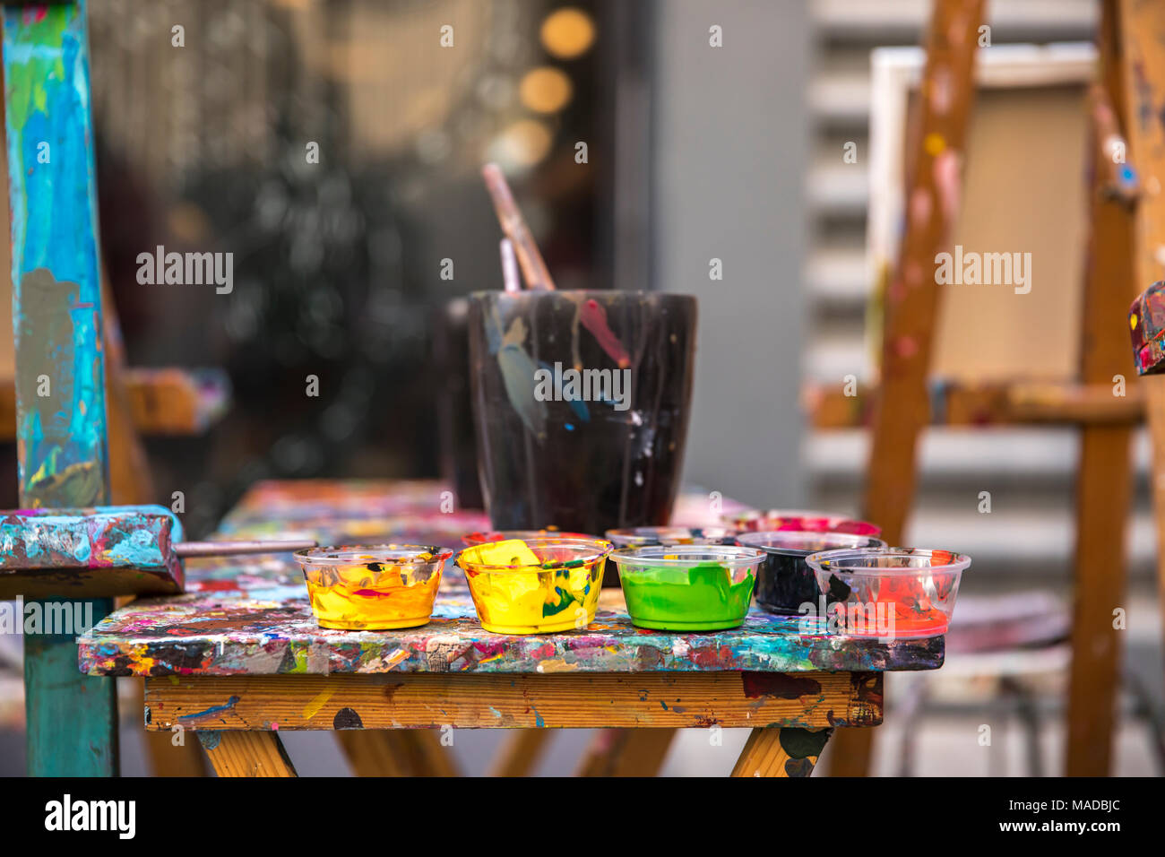 artist's paints and brushes on a table Stock Photo