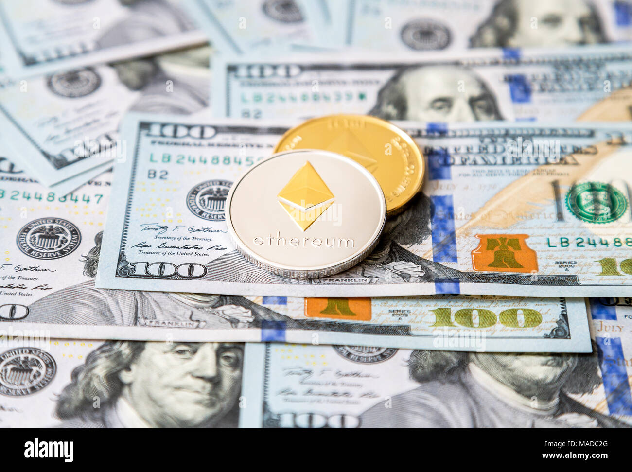 Ethereum on one hundred dollar banknote. Silver coin with Ethereum icon.  Digital crypto currency technology. Bitcoins in the background in silver  and Stock Photo - Alamy