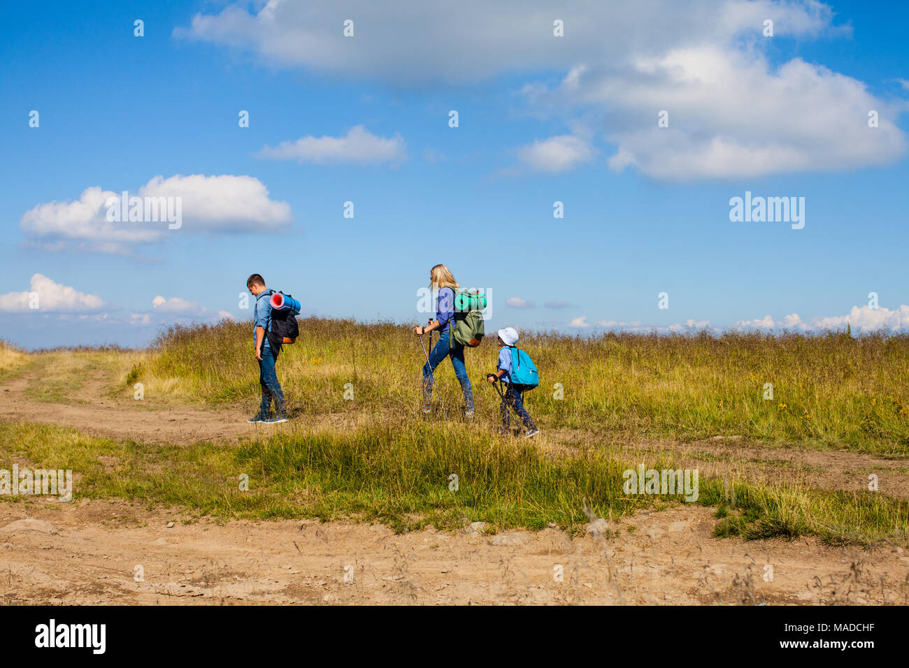 Family hiking in mountains Stock Photo - Alamy
