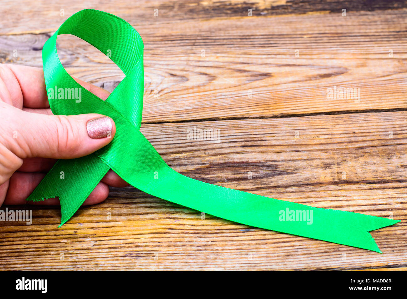 Green ribbon as symbol of awareness of the disease, World Health Day ...