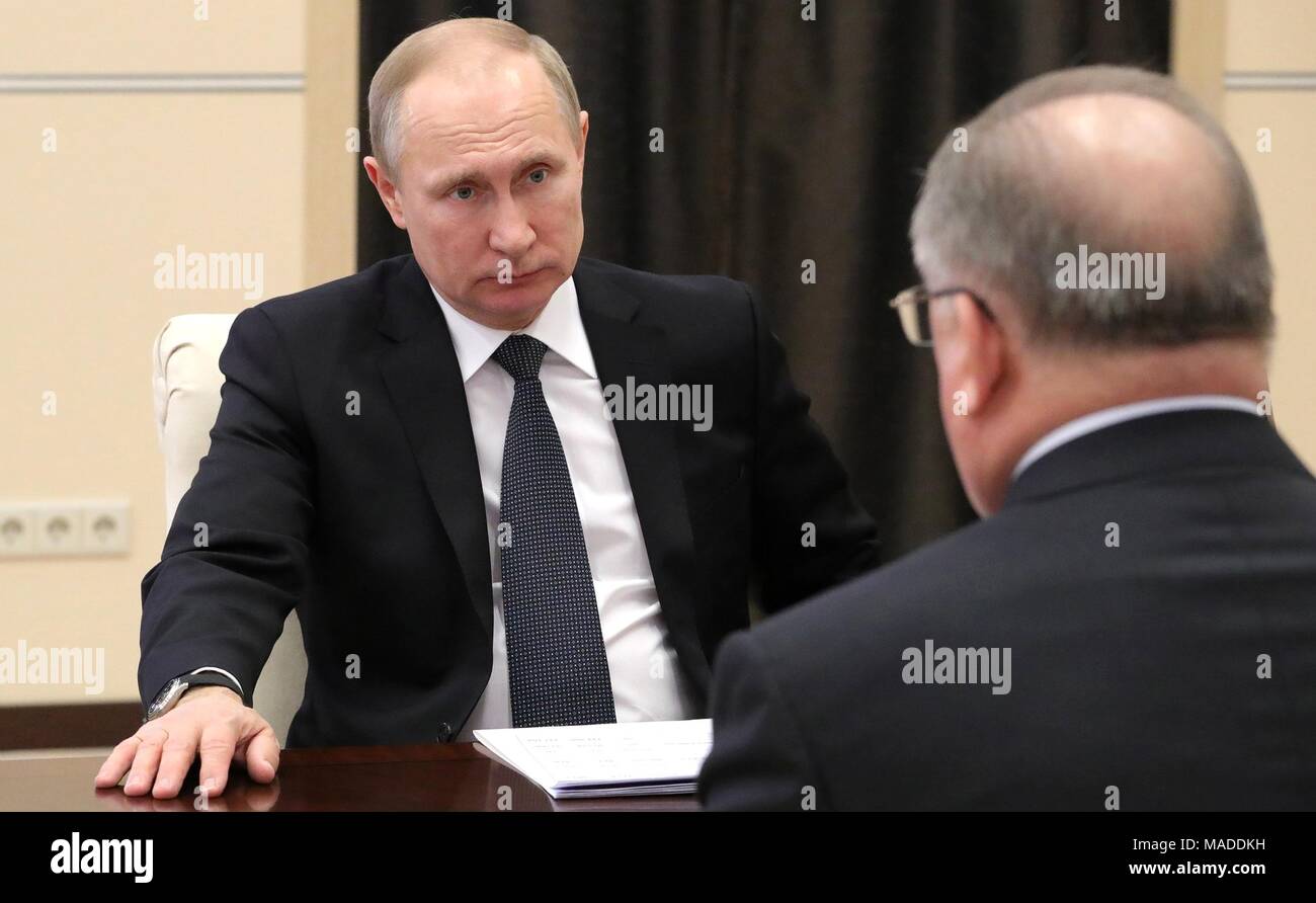Russian President Vladimir Putin holds a meeting with Transneft President Nikolai Tokarev at the presidential residence of Novo-Ogaryovo March 30, 2018 outside, Moscow, Russia. Transient is a Russian state-owned transport monopoly and the largest oil pipeline company in the world. Stock Photo