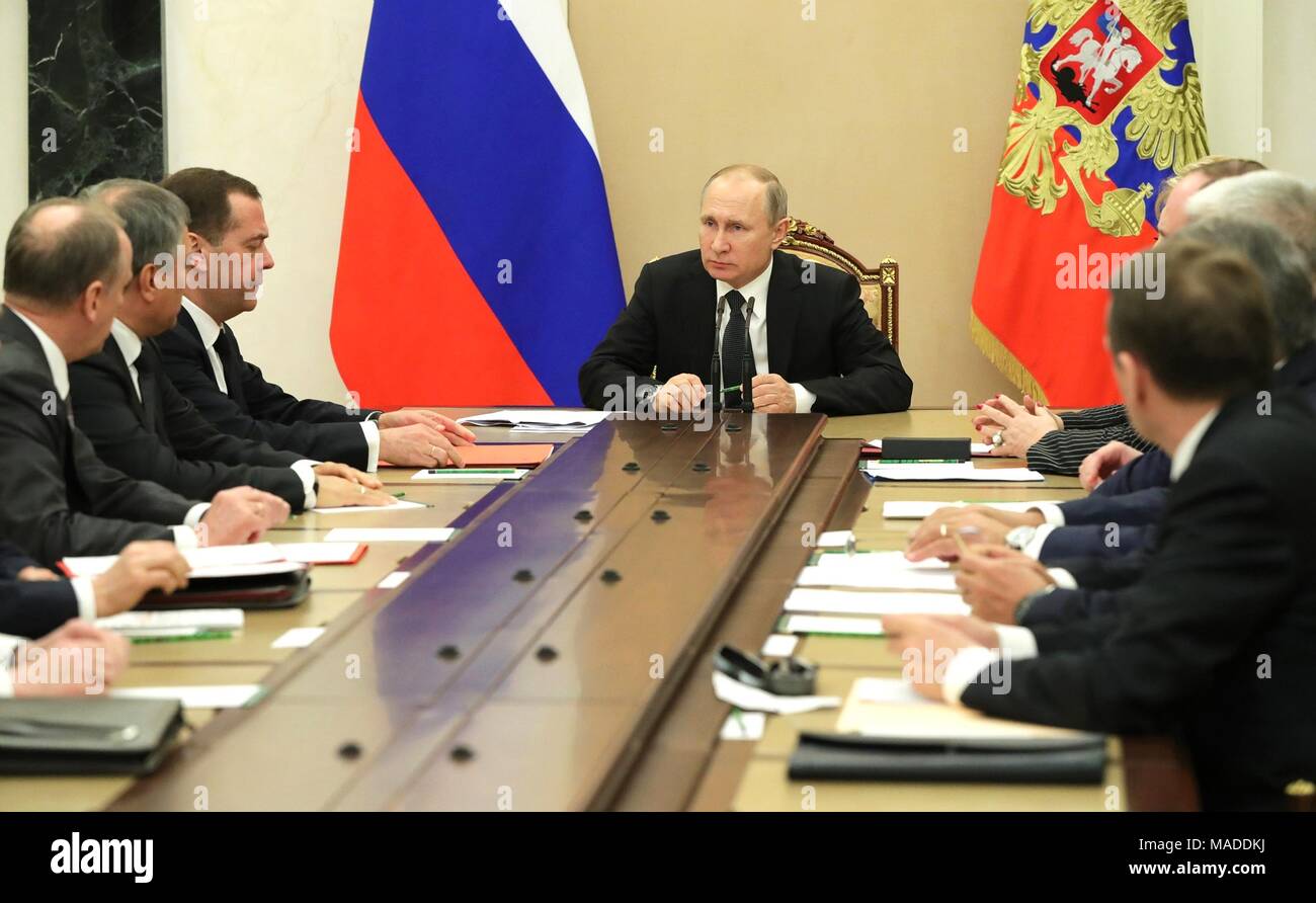 Russian President Vladimir Putin holds a meeting with the permanent members of the Security Council at the Kremlin March 30, 2018 in Moscow, Russia. Stock Photo