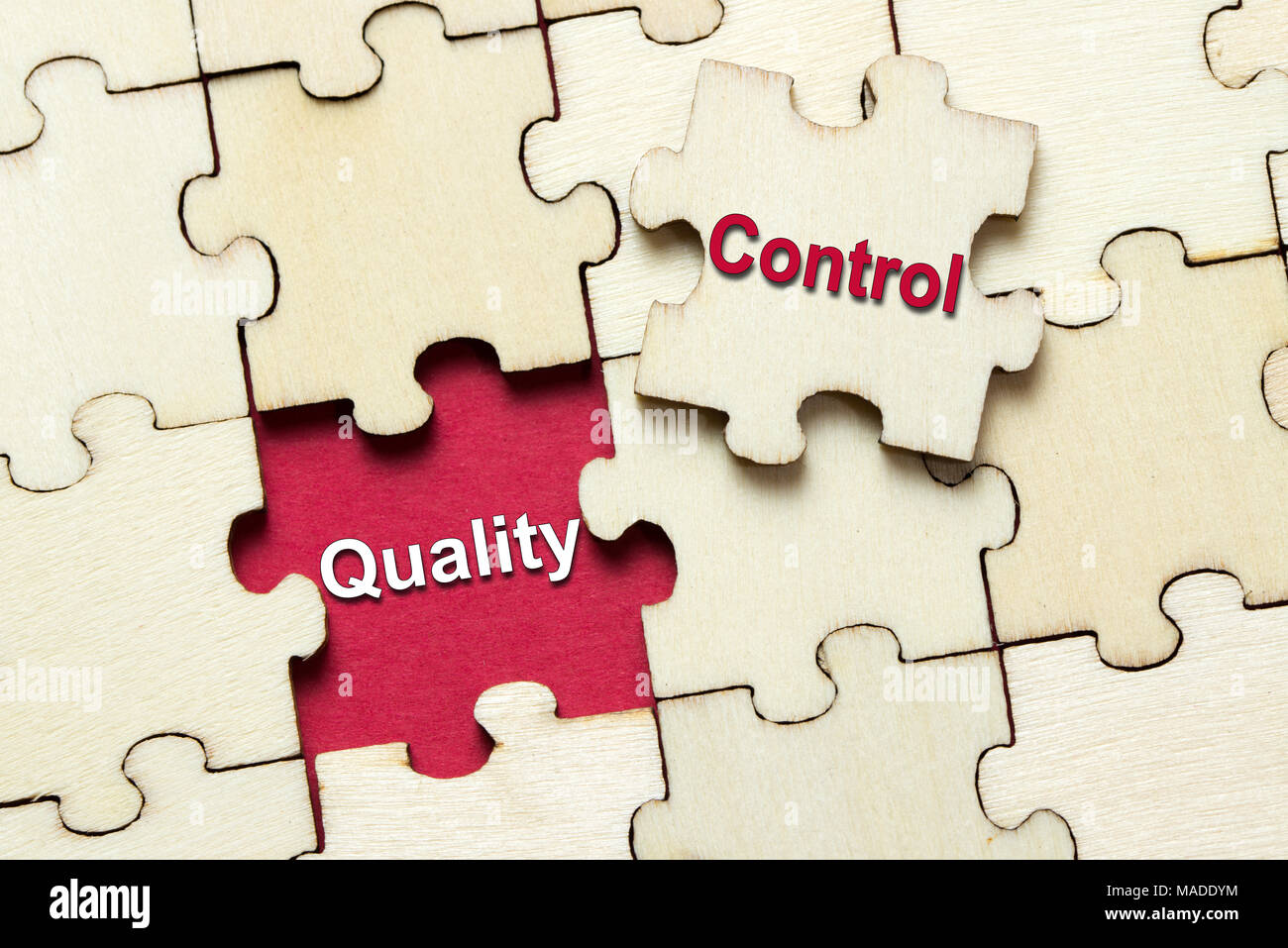 Puzzle pieces with word quality control Stock Photo - Alamy