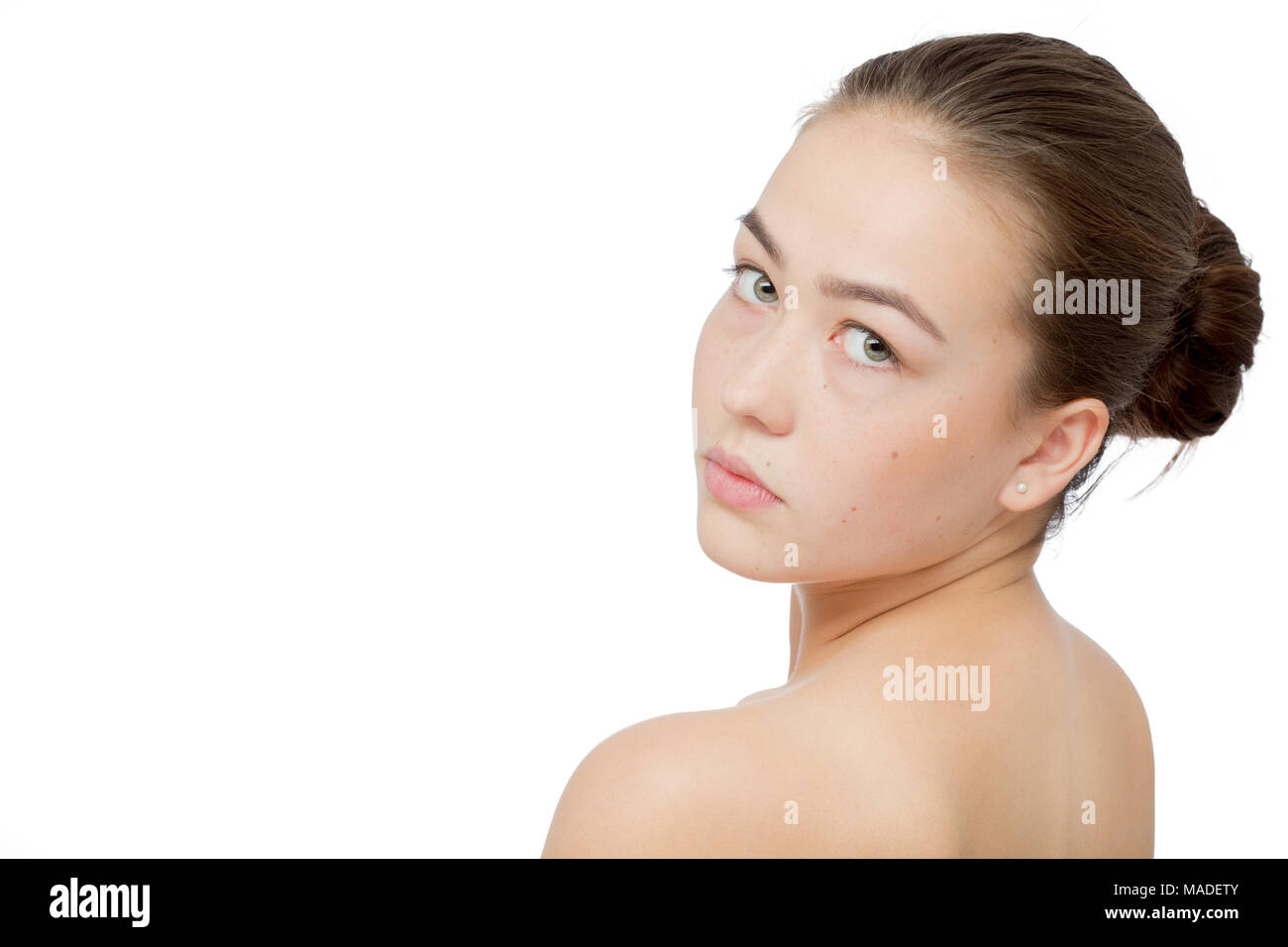 sad girl with clean skin isolated on white background with copy space  looking back over shoulder Stock Photo - Alamy