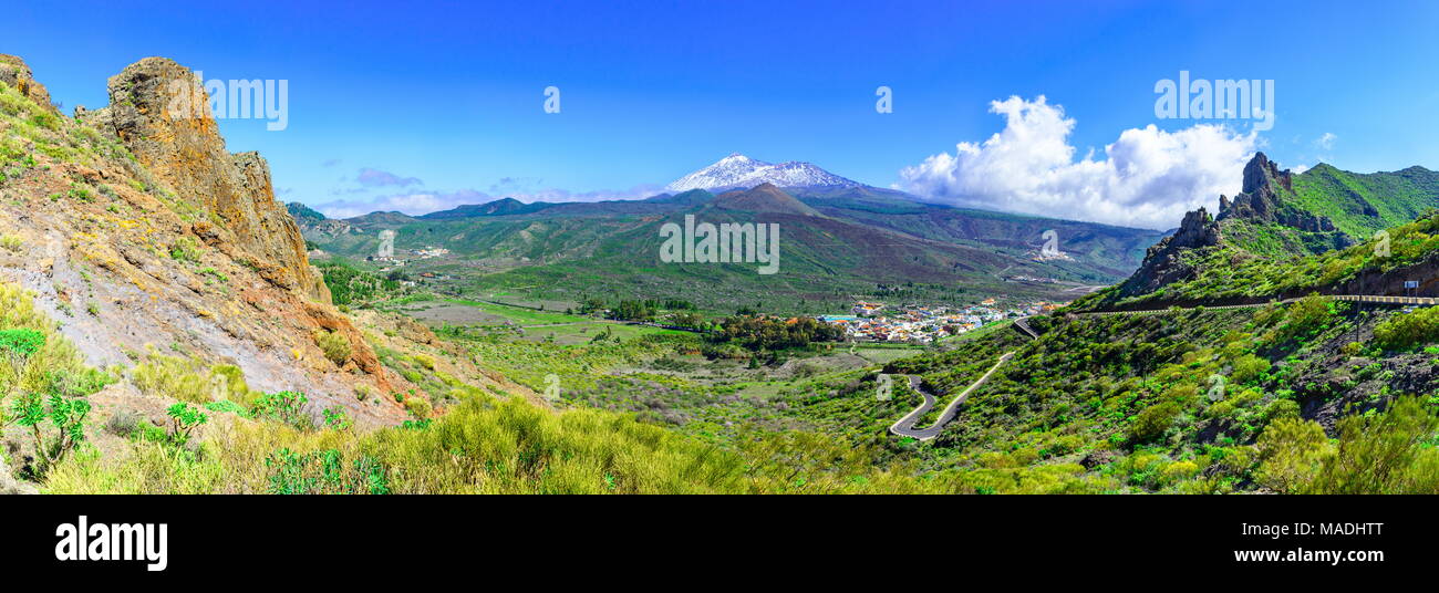 Tenerife, Canary islands, Spain: Beautiful landscape of a green valley with Teide volcano, covered in snow, in the background. Stock Photo