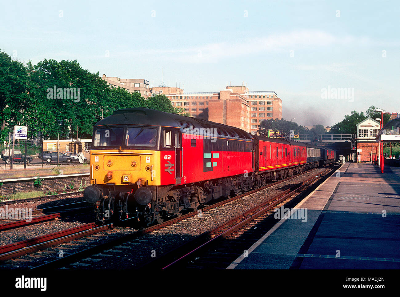A class 47 diesel locomotive number 47531 working a mail train passing through Kensington Olympia on the 7th July 1993. Stock Photo