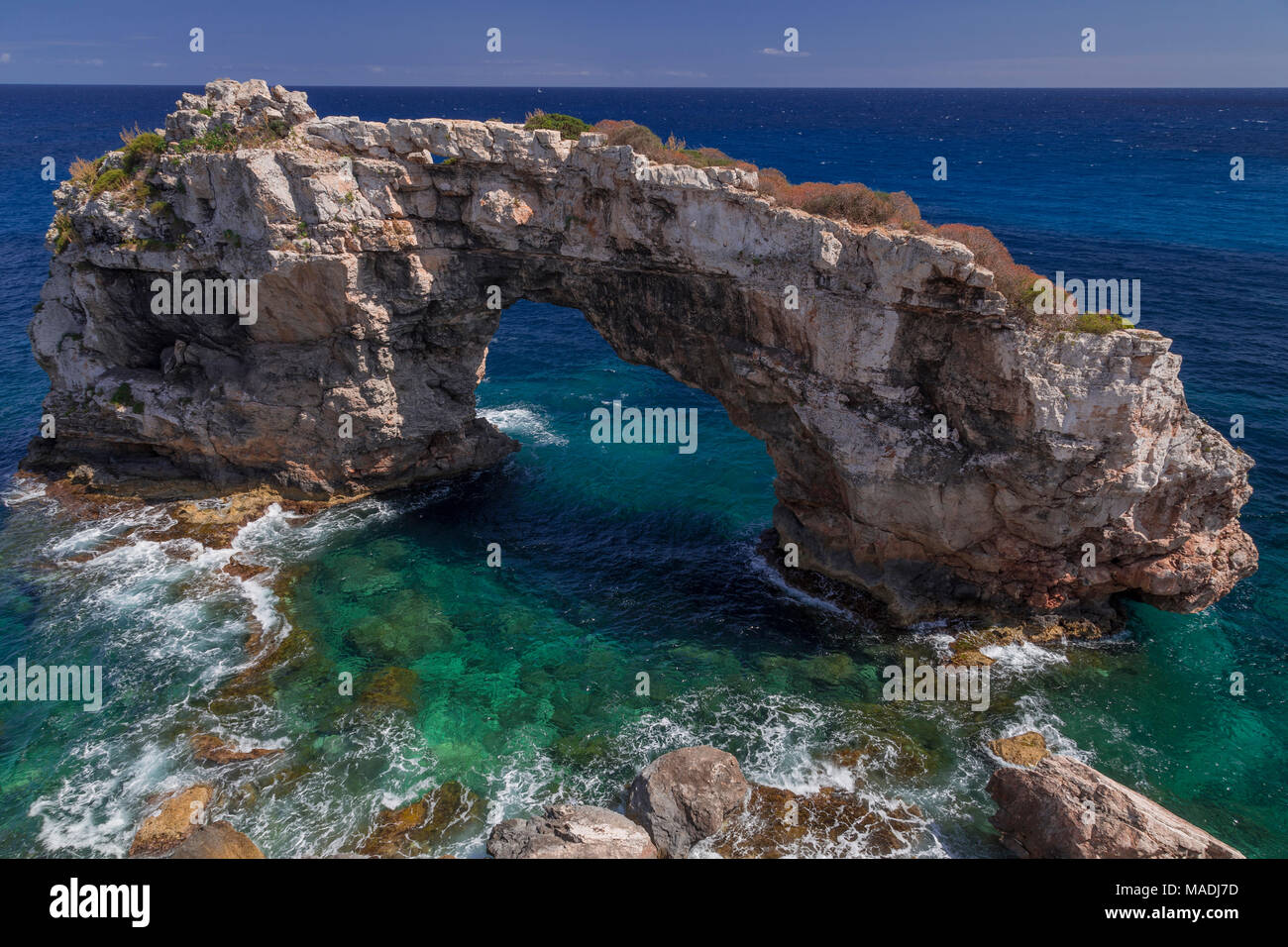 Rock arch on the Mediterranean coast of Mallorca at Santanyi on a sunny summer's day Stock Photo