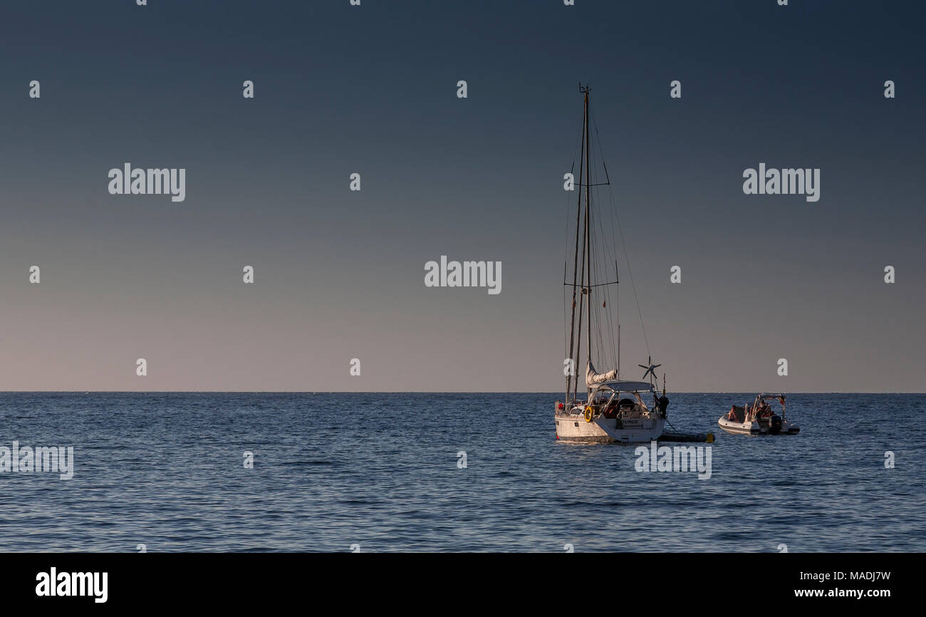 Solitary yacht on the Mediterranean Sea off the coast of Mallorca at Cala Tuent Stock Photo