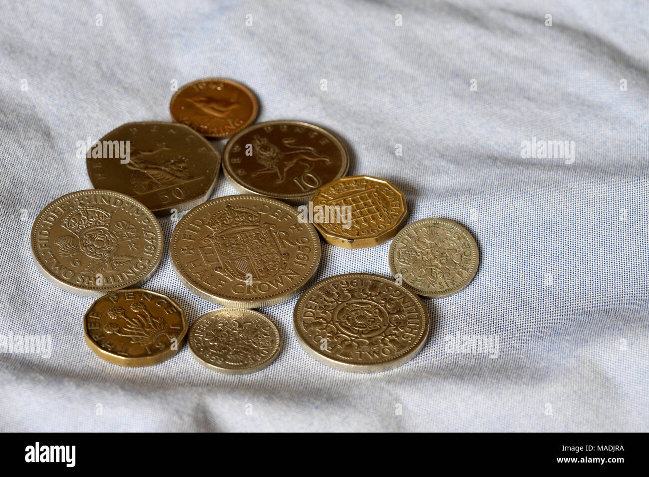 British identity and nostalgia for the past. Coins from the pre decimal and early decimal eras including half crown and two shilling pieces. Stock Photo