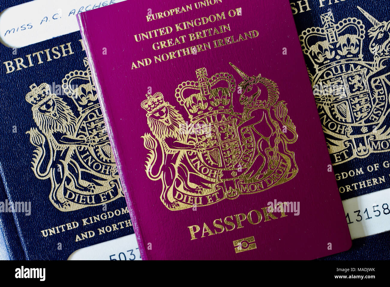 British identity and nostalgia for the past. The old blue British passport and the current red EU version which is under threat from Brexit. Stock Photo