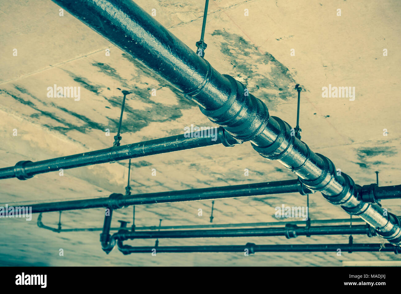 Old water pipes under roof Stock Photo Alamy