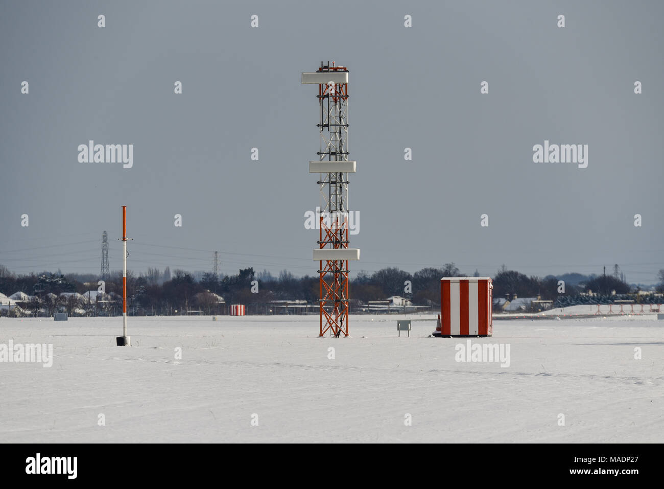 London Southend Airport infrastructure in snow bad weather during the Beast from the East weather phenomenon. ILS Glide slope tower landing system Stock Photo