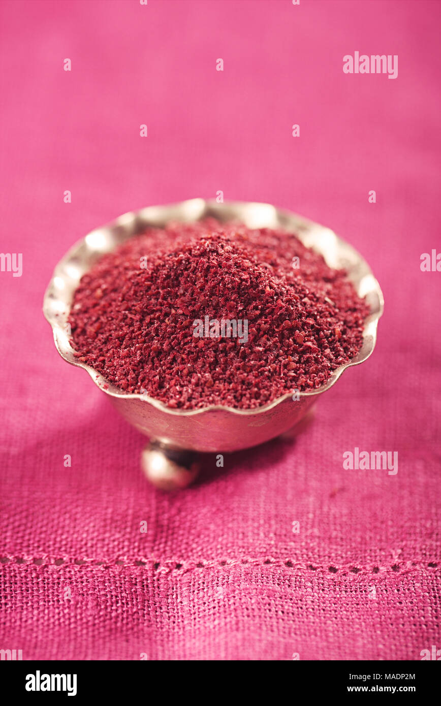 Ground Red Sumac Berries spice in silver bowl Stock Photo Alamy