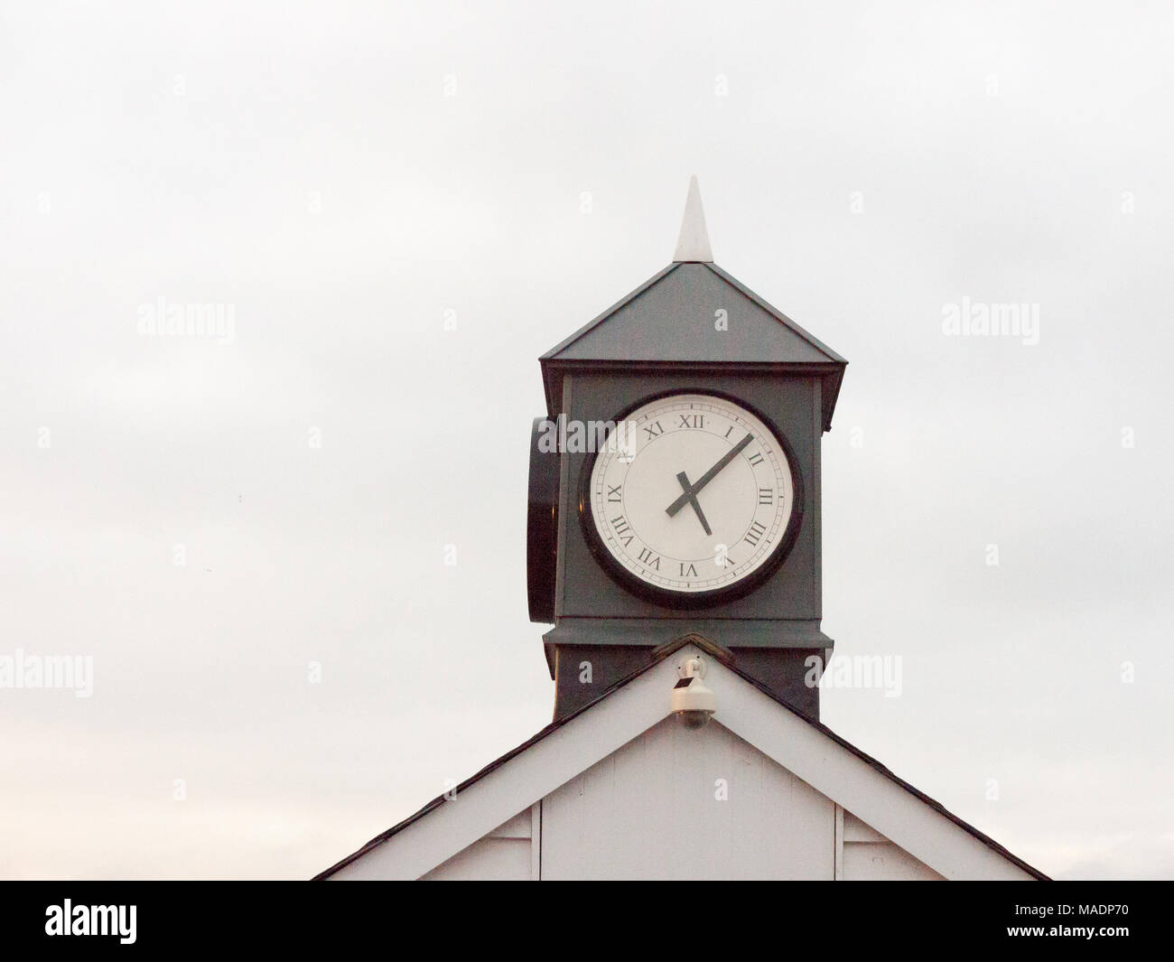 old analogue clock black and white tower of town tower building sky