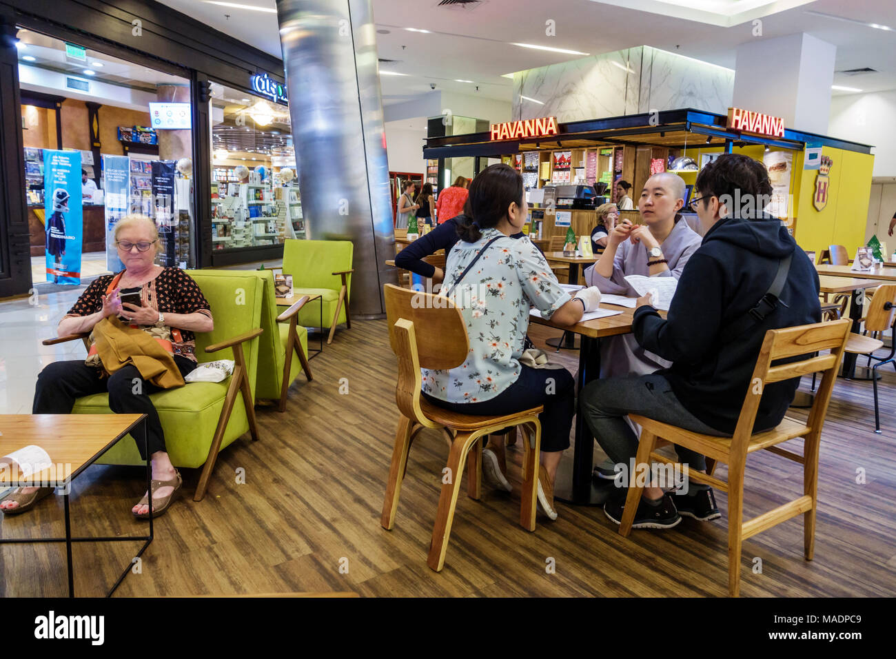 Buenos Aires Argentina,Recoleta mall,interior inside,Havanna,cafe,table,Asian Asians ethnic immigrant immigrants minority,family families parent paren Stock Photo